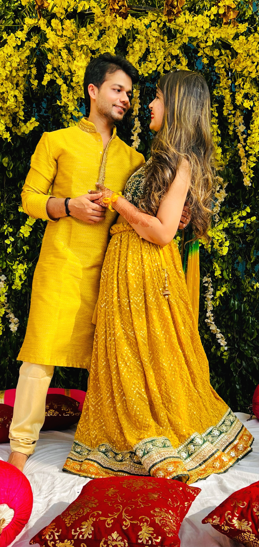 A couple in traditional haldi attire